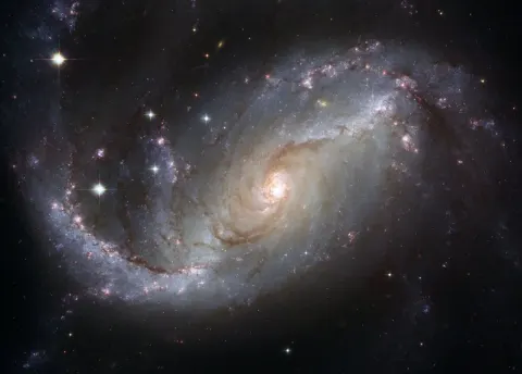Star field and glowing nebula colors against dark space