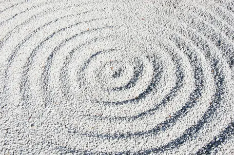 Concentric circles raked into fine white sand