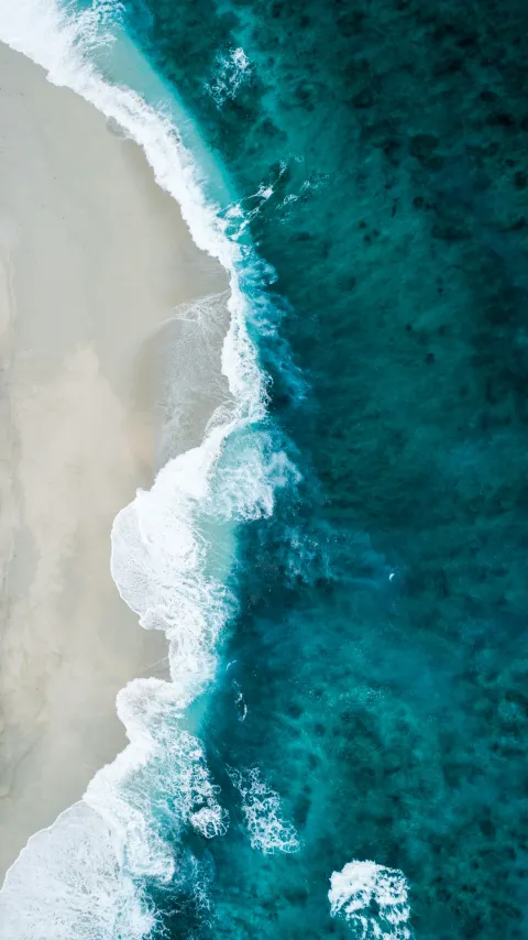 Soft ripples across clear turquoise water like gentle sound waves