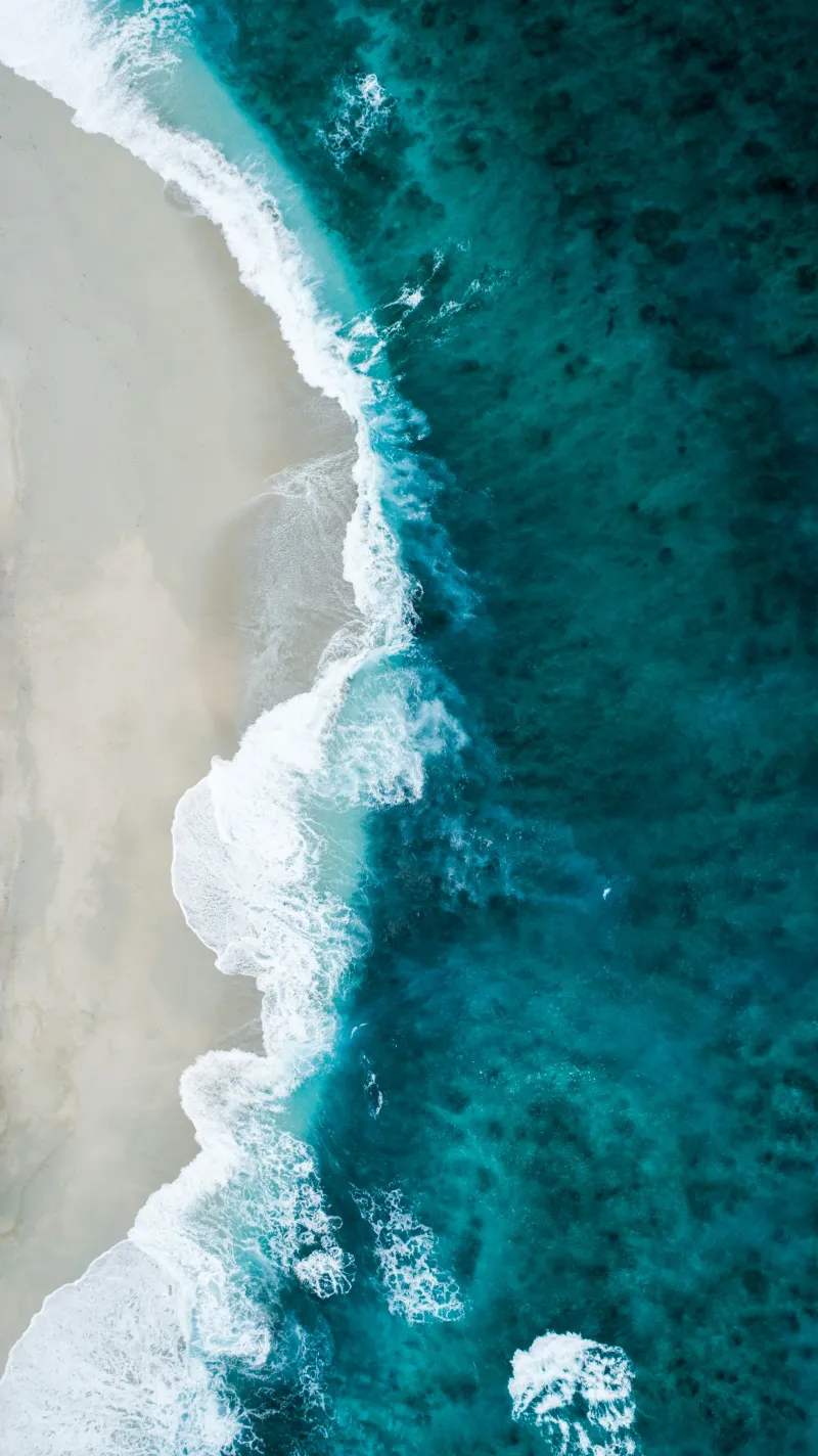 Soft ripples across clear turquoise water like gentle sound waves