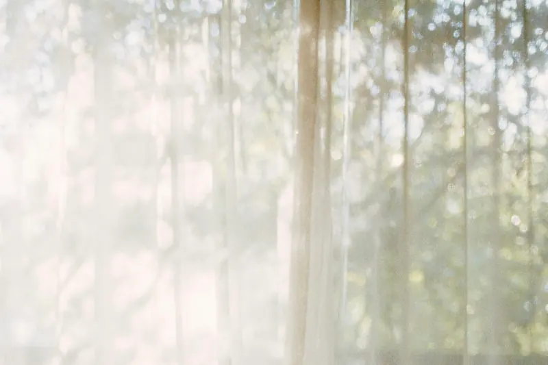 Sunlight through sheer curtains