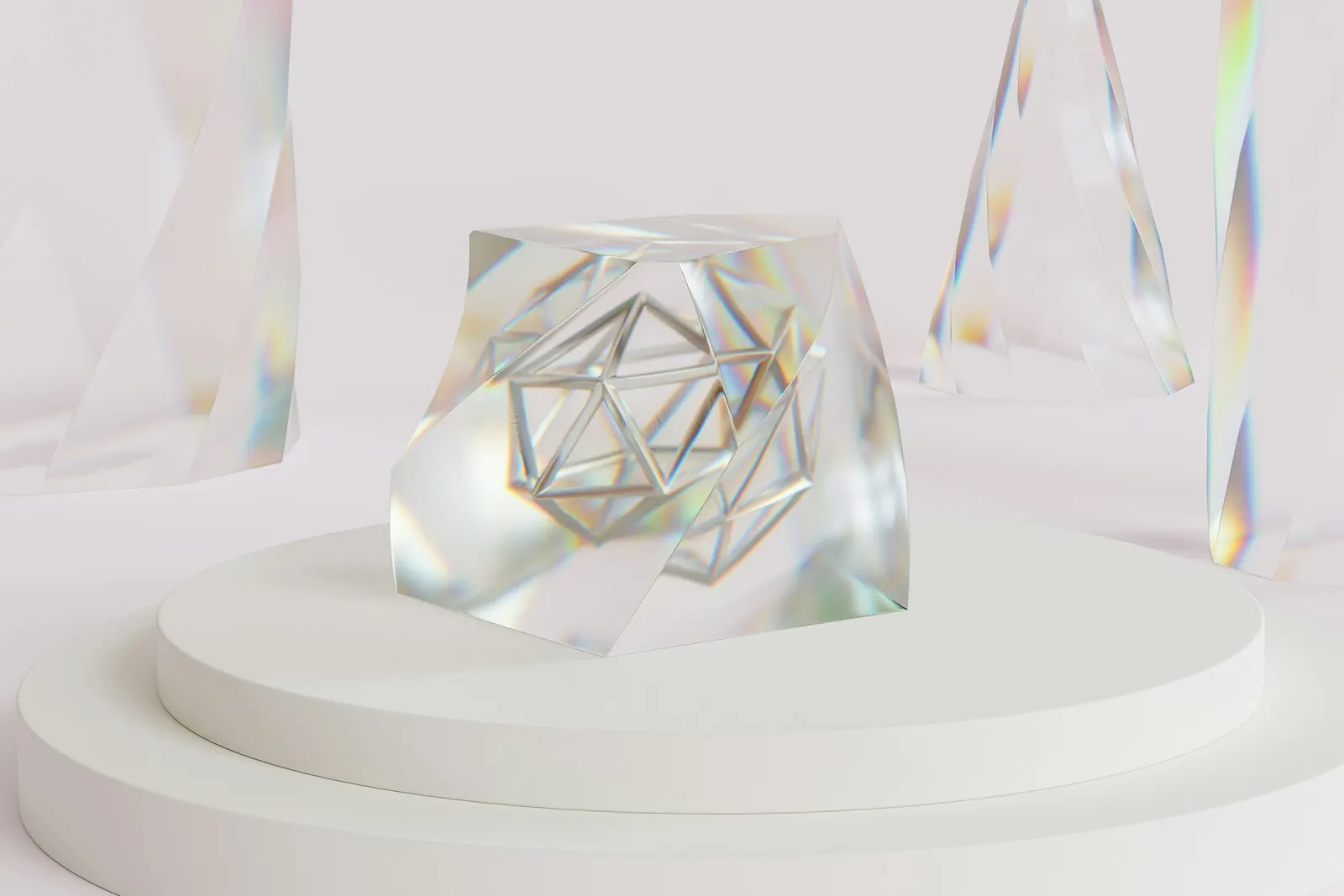 A clear glass geometric object on a white pedestal